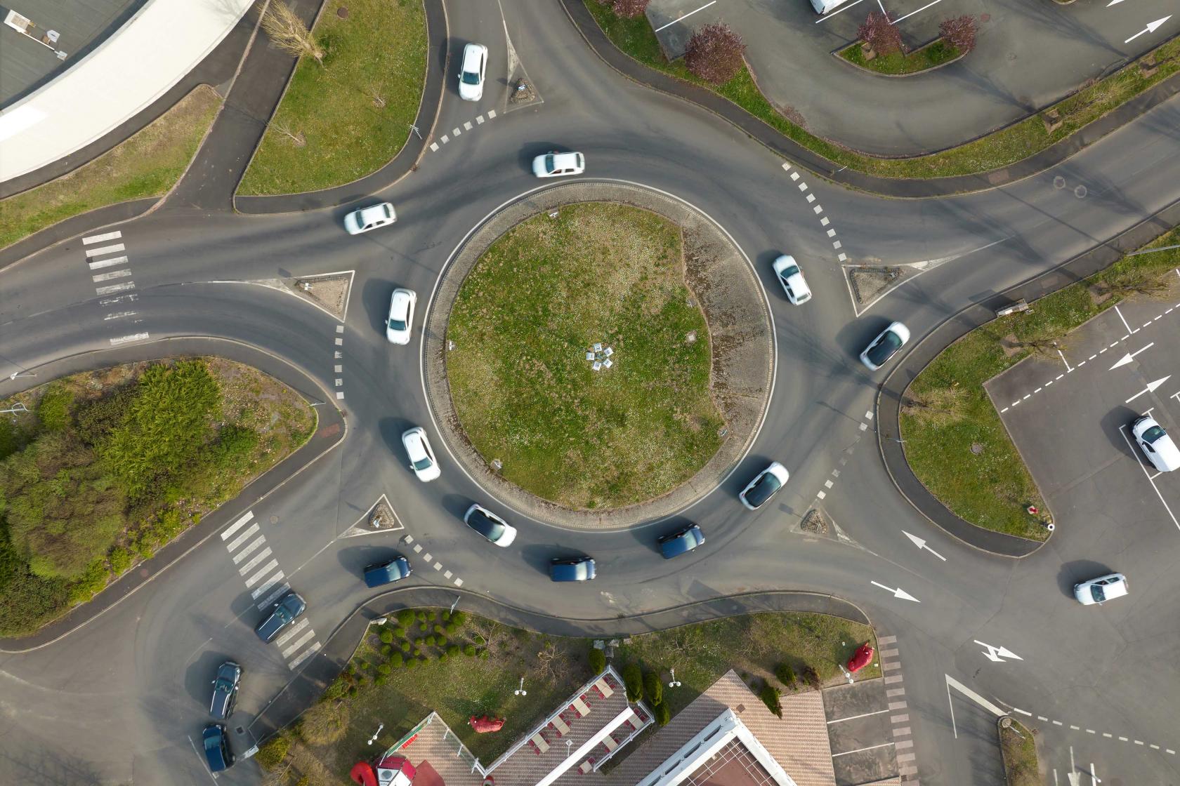 aerial-view-road-roundabout-intersection-with-fast-moving-heavy-traffic-urban-circular-transportation-crossroads.jpg
