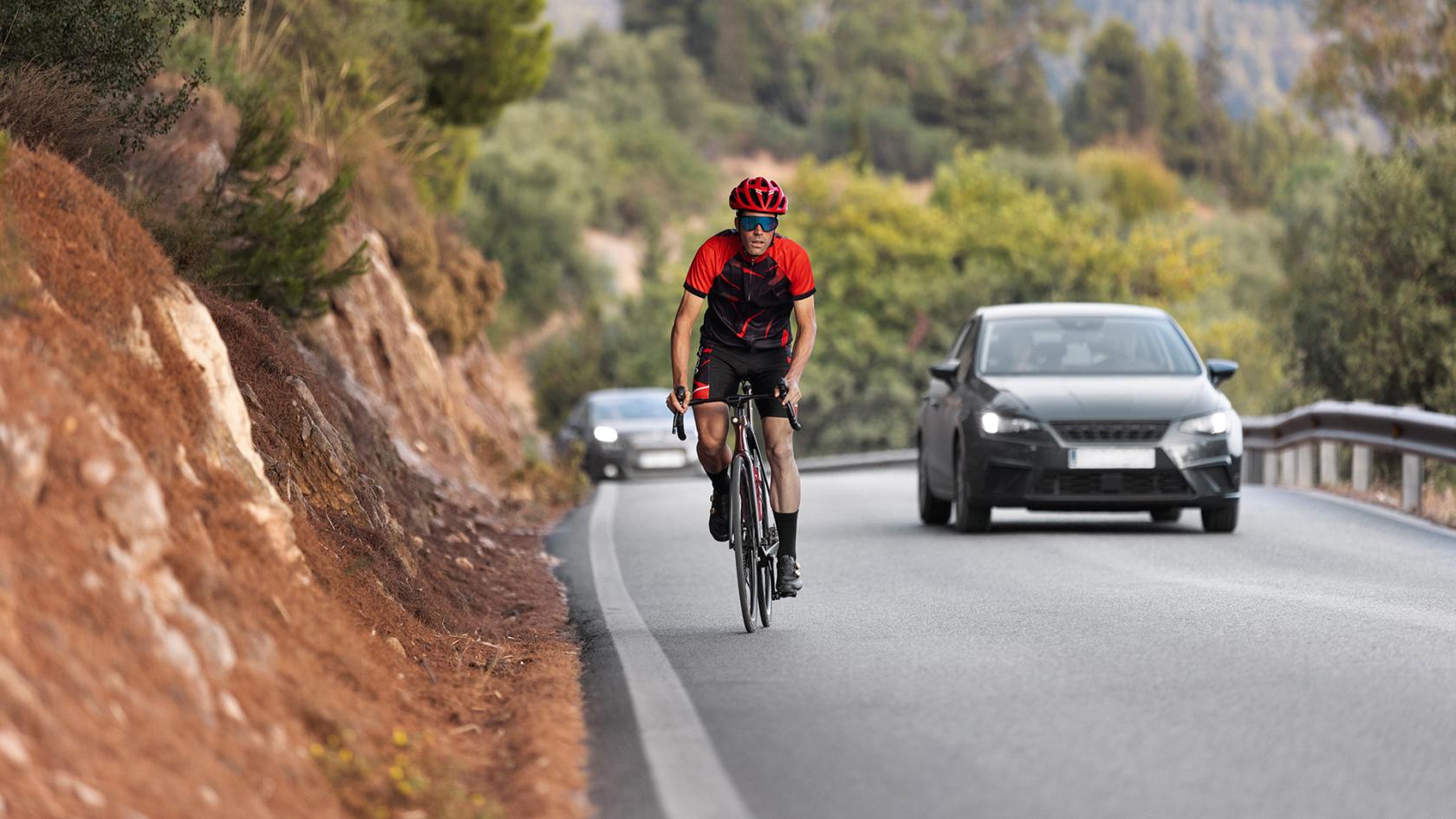 male-cyclist-training-with-bicycle-outdoors.jpg