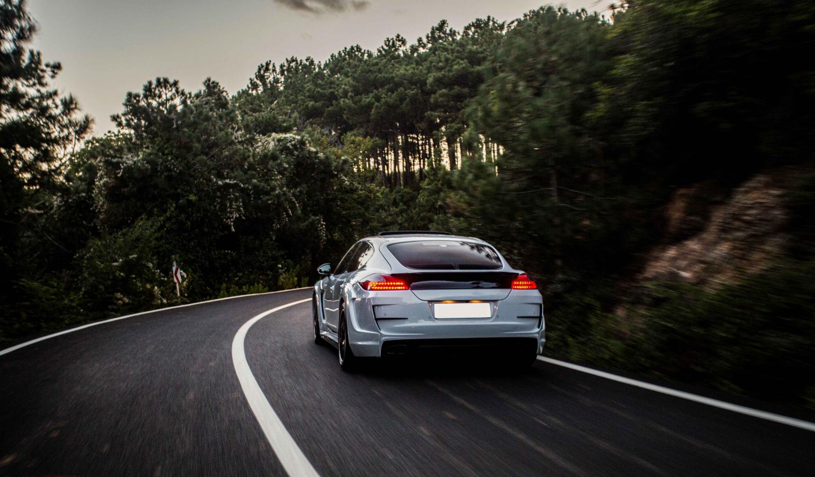 sport-car-with-black-white-autotuning-driving-forest.jpg