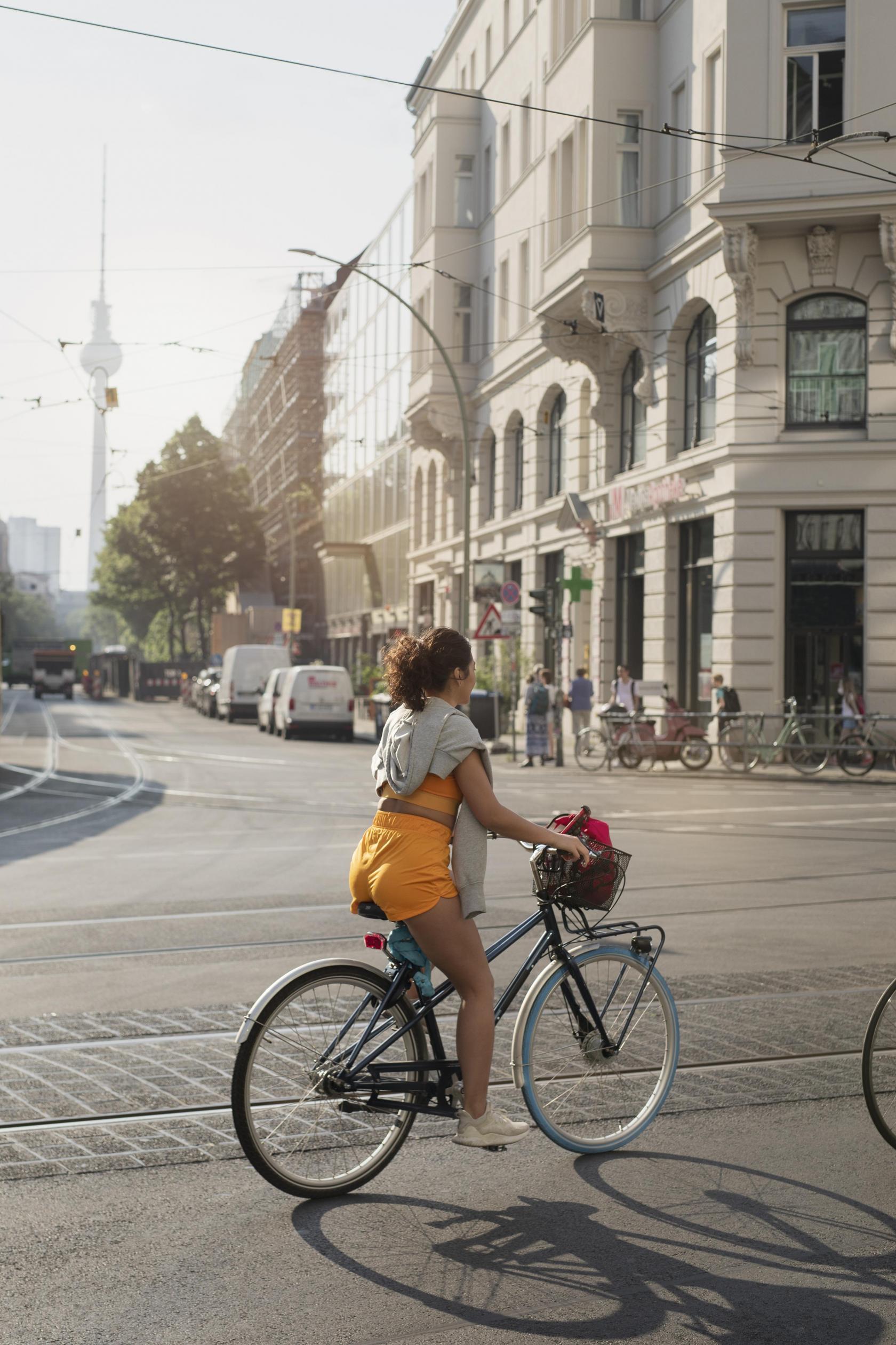 full-shot-woman-riding-bicycle.jpg