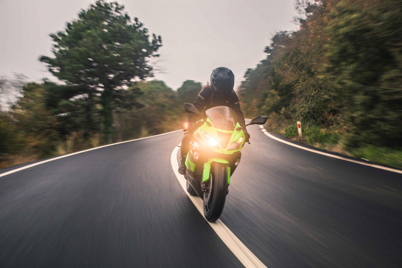 driving-green-neon-color-motorcycle-road-front-view.jpg